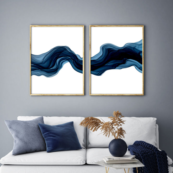 blue abstract wave wall art set above cream sofa