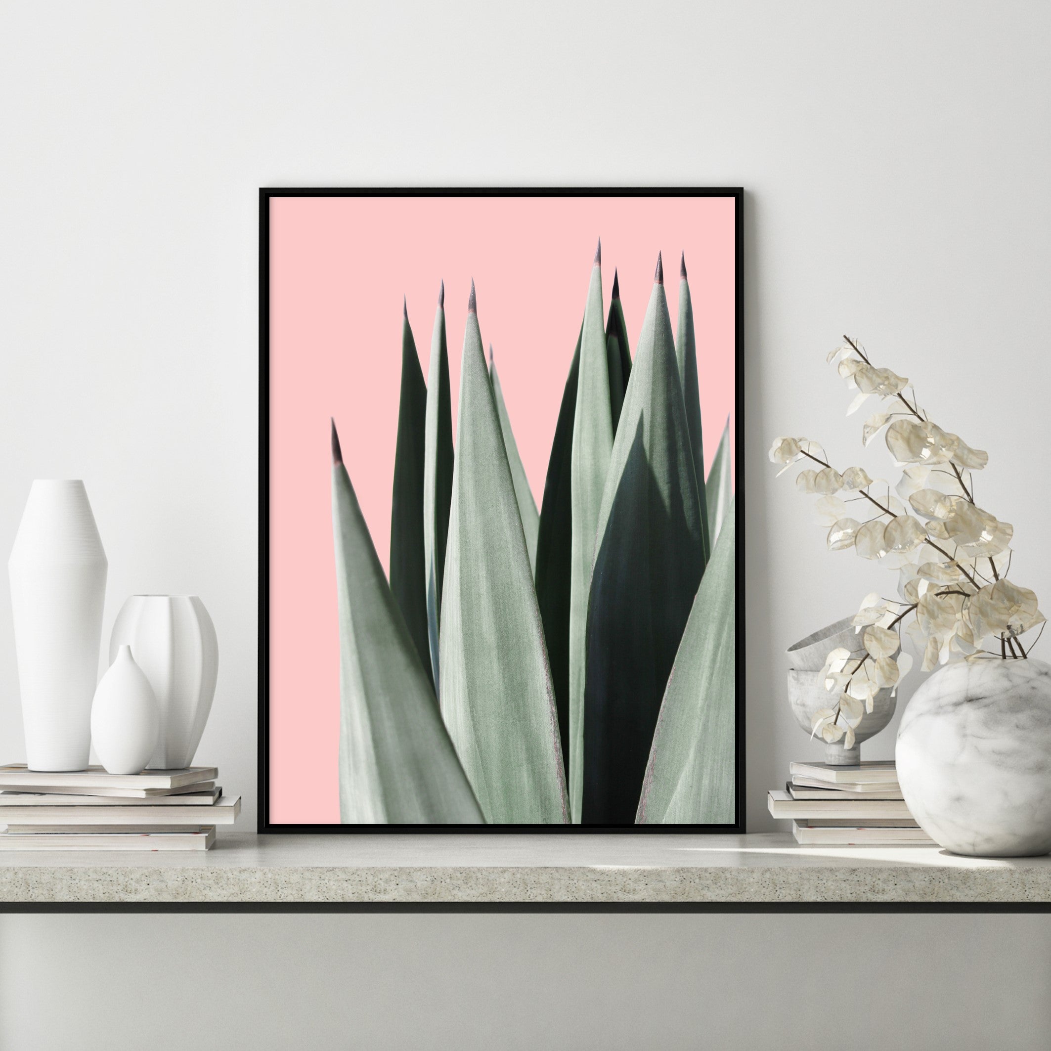 tall leaves on pink poster in modern room