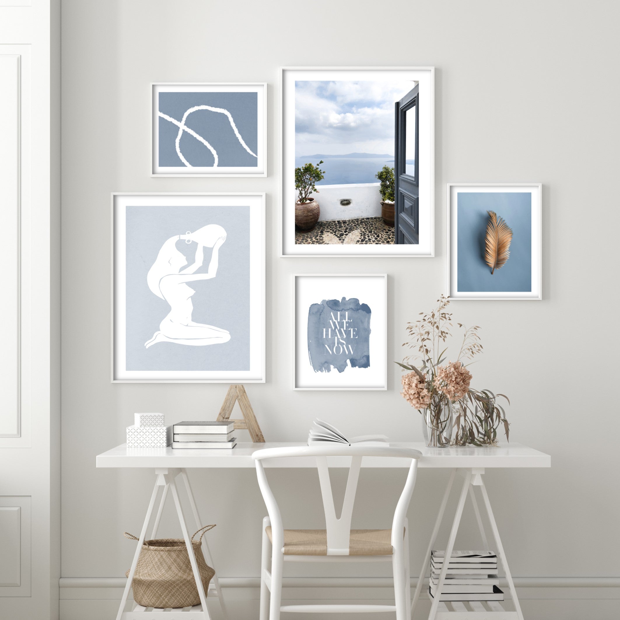 woman puring water on her head art print  in white and navy blue decor next to a desk