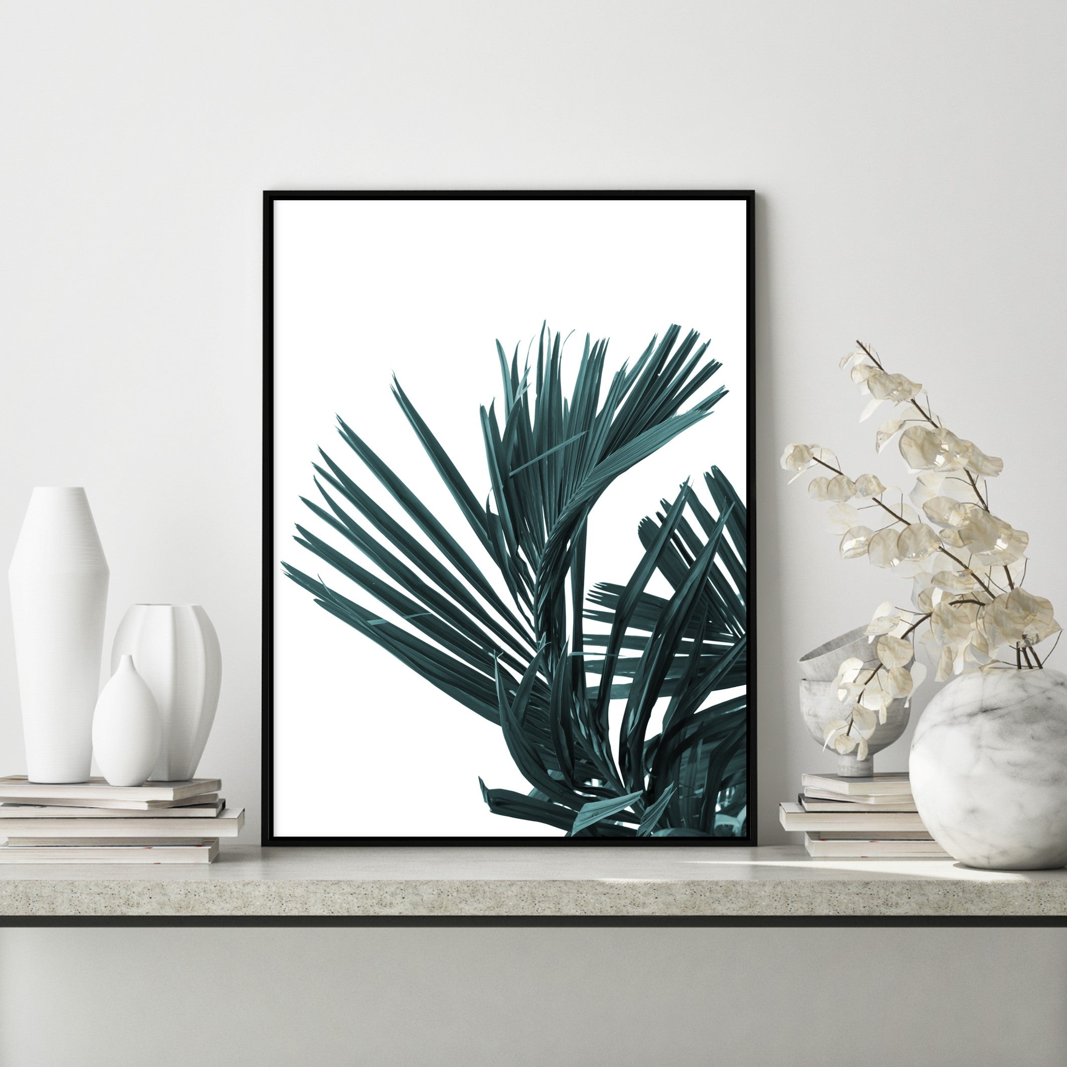 dark green botanical palm leaf poster in scandi home