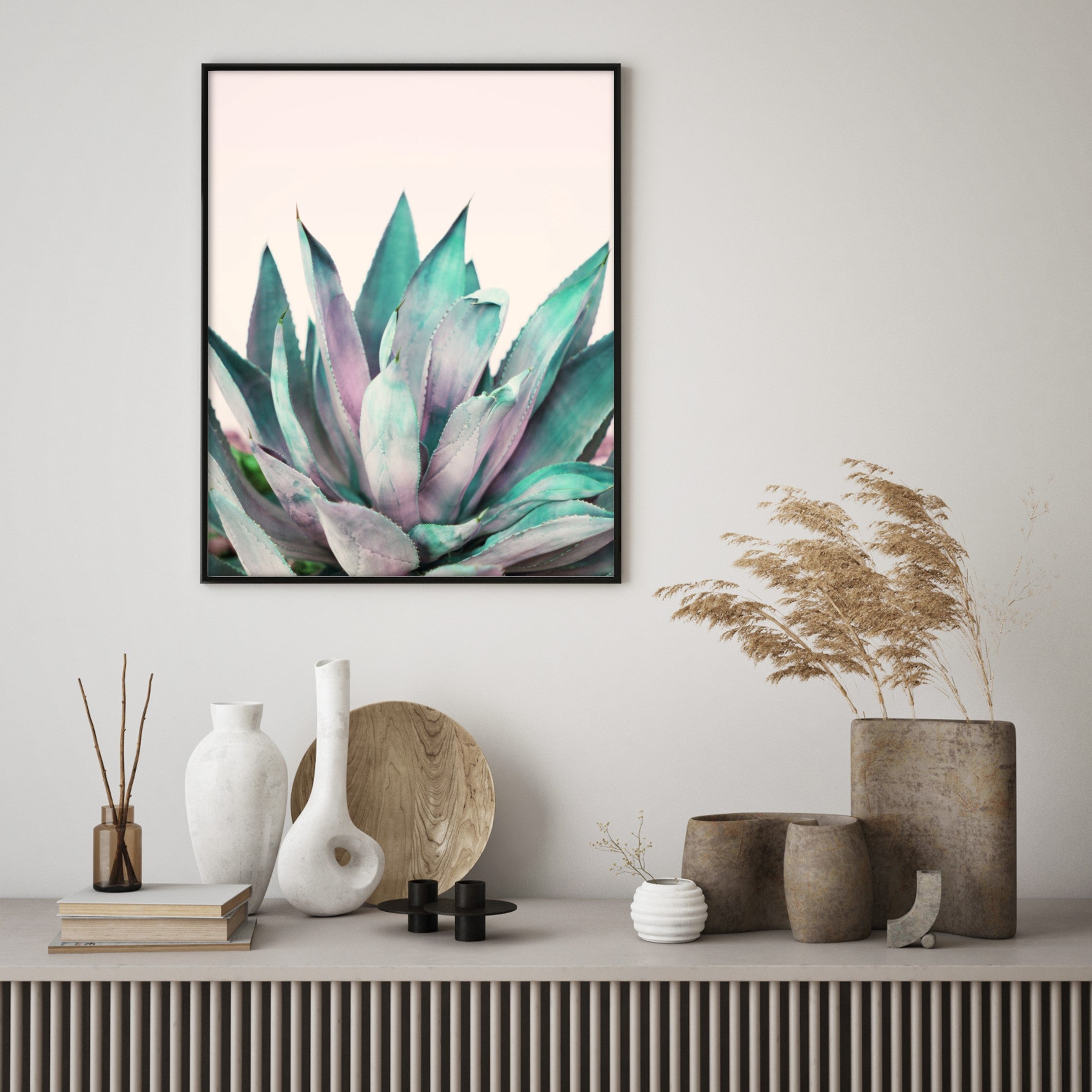 small plant on pink poster in scandi room